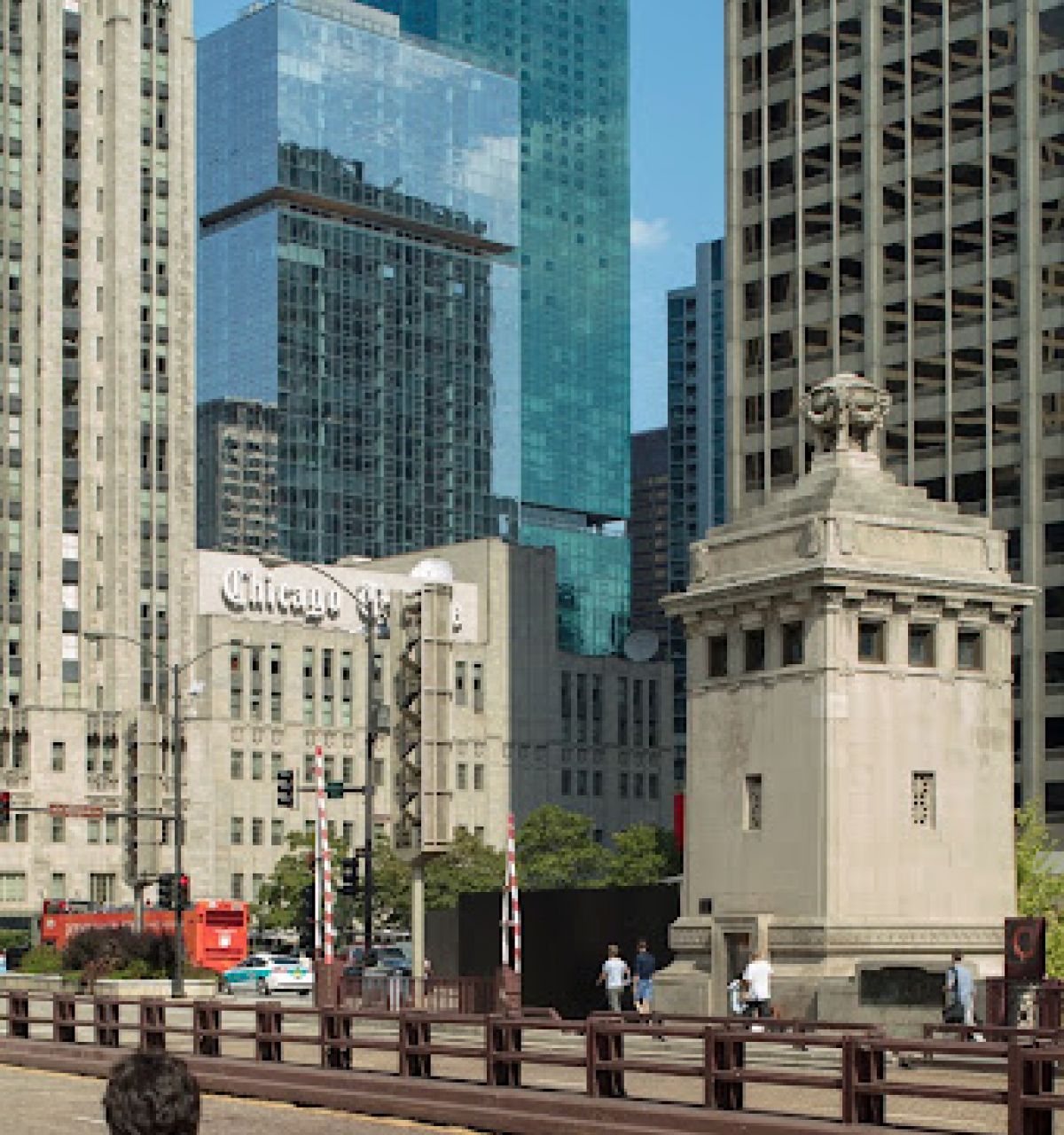 Optima Lakeview® Apartments in Chicago, IL People walk on a downtown Chicago street, showcasing the city’s architectural diversity with modern and historic skyscrapers behind them.