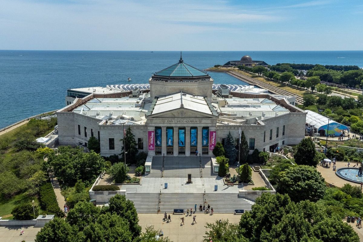 Optima Lakeview® Apartments in Chicago, IL Aerial view of the Shedd Aquarium, one of Chicago’s Icons, with Lake Michigan in the background.