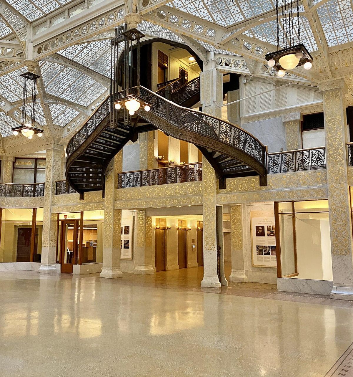 Optima Lakeview® Apartments in Chicago, IL Ornate iron staircase and glass ceiling in a spacious, historic interior—perfect for discovering Chicago's architectural gems.
