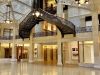 Optima Lakeview® Apartments in Chicago, IL Ornate iron staircase and glass ceiling in a spacious, historic interior—perfect for discovering Chicago's architectural gems.