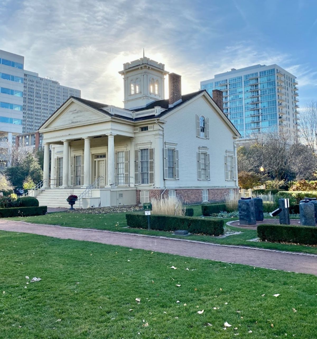 Optima Lakeview® Apartments in Chicago, IL The Clarke-Ford House, Chicago's oldest home, features columns and gardens amid the city's modern skyline.