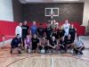 Optima Lakeview® Apartments in Chicago, IL A group of eighteen pickleball players posing for a photo on an indoor court.