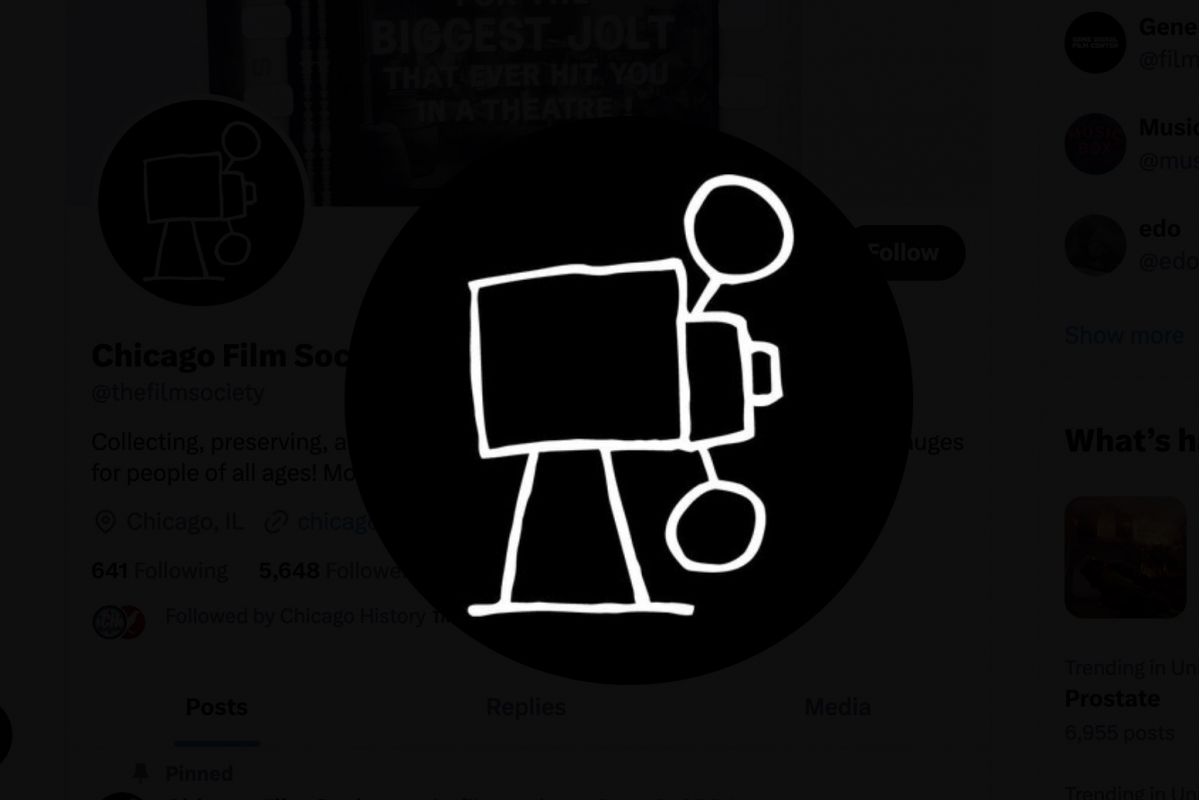 Optima Lakeview® Apartments in Chicago, IL White hand-drawn film camera icon on a black circular background, perfect for Chicago Film Society fans discovering hidden gems.