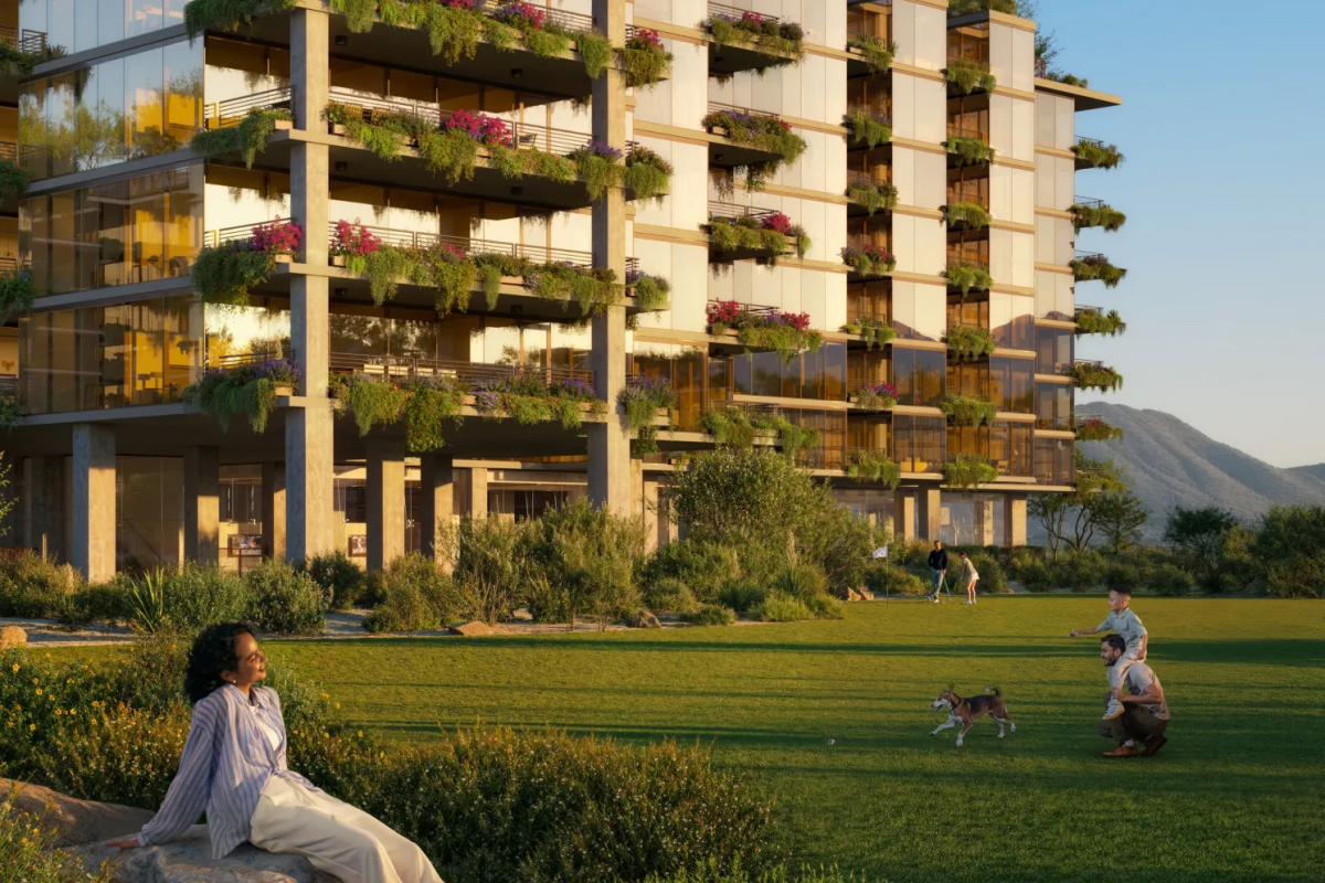 Optima Lakeview® Apartments in Chicago, IL Modern apartment building with lush balconies, where people relax on the green lawn, embracing mental clarity inspired by Japanese philosophy.