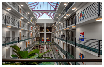 Optima Lakeview® Apartments in Chicago, IL Spacious, modern atrium with balconies, skylights, plants, and colorful artwork on white walls.